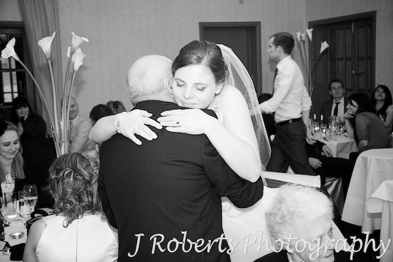 Bride hugging her father after wedding speech - wedding photography sydney